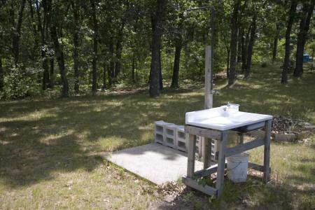 outdoor shower with cleaning station