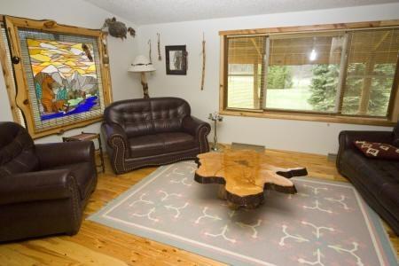 spacious living room w/ custom made furniture