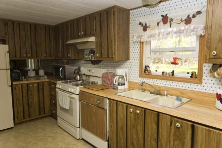 spacious kitchen w/ wooden cabinetry