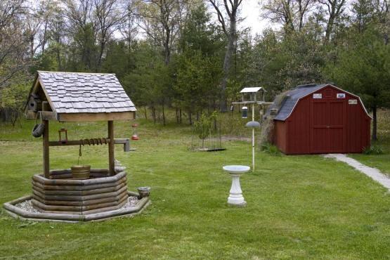 landscaped yard with storage sheds