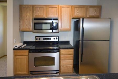 spacious kitchen with steel built-in appliances included