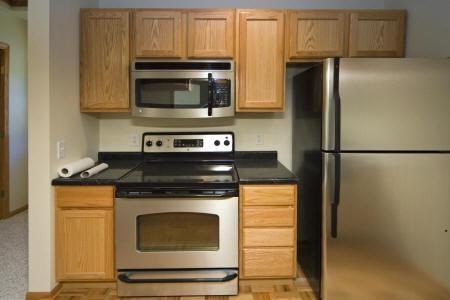 spacious kitchen with built in steel appliances