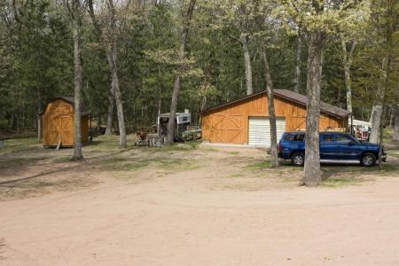 three-car detached barraged and utility showed