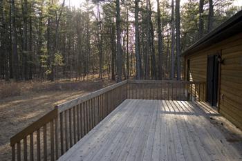 large back deck to view wooded land