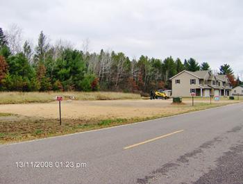 harborview condominium with paved road frontage