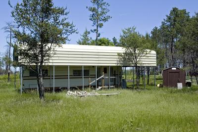 Wooded buildable land with camper included
