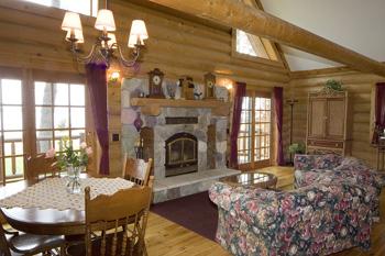 Huge Living Room With Stone Wooded Burning Fireplace
