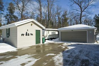 Spacious Garage and detached workshop with property