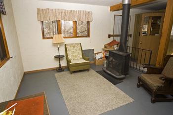 Cozy Living Room With Stove Heat!